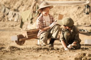 children studying archaology