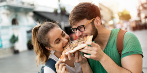 two people eating pizza